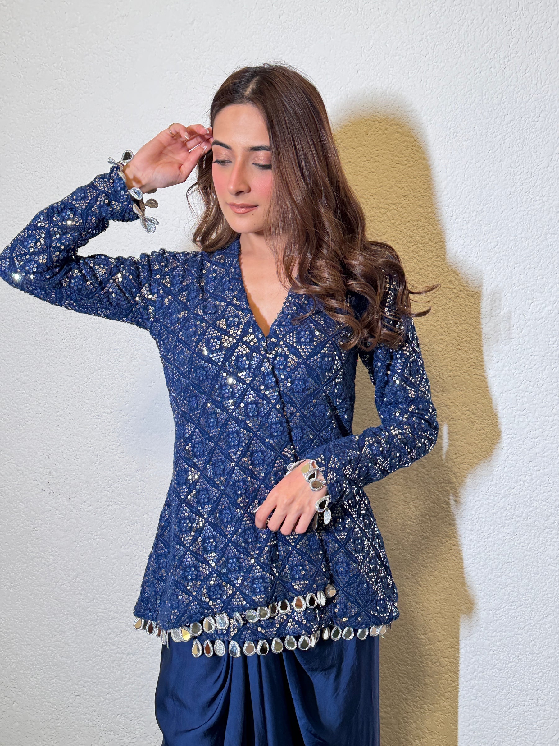 "Richly embroidered Chinon Silk top with threadwork and vibrant accents"
